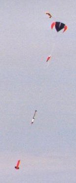 A High Power Rocket descending under a parachute