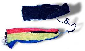 A parachute next to its deployment bag